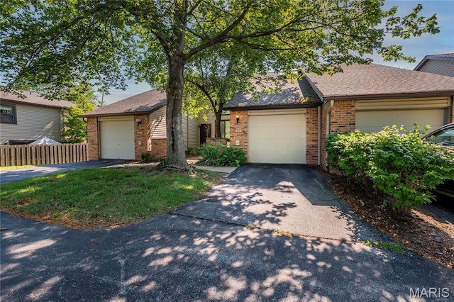 1756 Pineberry Ct, Creve Coeur Township, MO 63146 - view of front facade with brick siding, asphalt driveway, an attached garage, and roof with shingles
