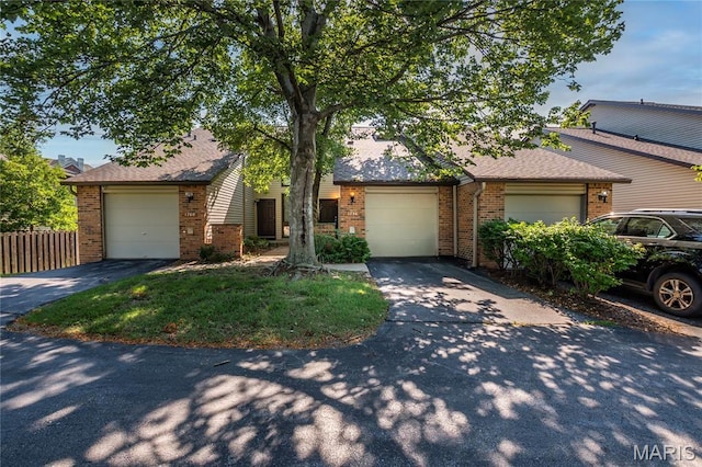 1756 Pineberry Ct, Creve Coeur Township, MO 63146 - view of front of home with brick siding, driveway, and roof with shingles