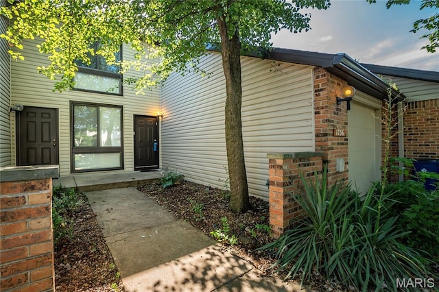 1756 Pineberry Ct, Creve Coeur Township, MO 63146 - property entrance featuring brick siding and an attached garage