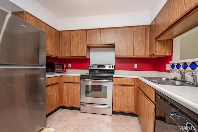 1756 Pineberry Ct, Creve Coeur Township, MO 63146 - kitchen with stainless steel appliances, light countertops, and brown cabinets