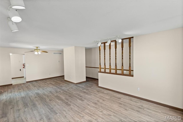 1520 Royal Oak Ct, Ofallon, IL 62269 - unfurnished living room featuring wood finished floors and ceiling fan
