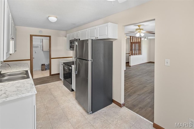 1520 Royal Oak Ct, Ofallon, IL 62269 - kitchen featuring stainless steel appliances, a ceiling fan, white cabinets, light countertops, and light tile patterned floors
