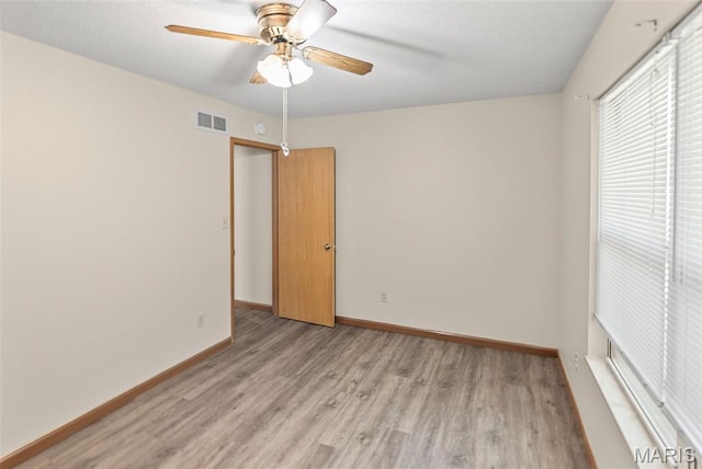 1520 Royal Oak Ct, Ofallon, IL 62269 - spare room with light wood-style floors and ceiling fan