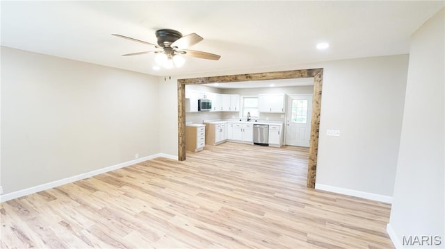 850 Cambridge Dr, Sikeston, MO 63801 - kitchen with stainless steel appliances, ceiling fan, light countertops, light wood finished floors, and white cabinets