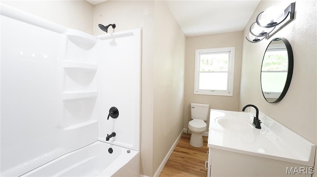 850 Cambridge Dr, Sikeston, MO 63801 - full bath featuring vanity, wood finished floors, and tub / shower combination