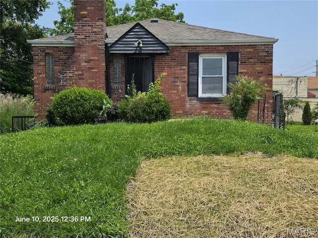 6203 Dardanella Ave, Normandy, MO 63121 - view of front facade featuring a chimney, brick siding, and a shingled roof