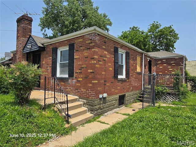 6203 Dardanella Ave, Normandy, MO 63121 - view of side of property with a chimney and brick siding