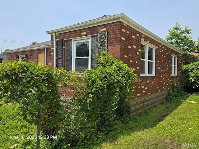 6203 Dardanella Ave, Normandy, MO 63121 - view of side of property featuring brick siding and a yard