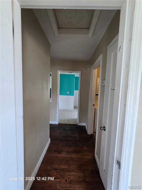 6203 Dardanella Ave, Normandy, MO 63121 - corridor with attic access and dark wood-style floors