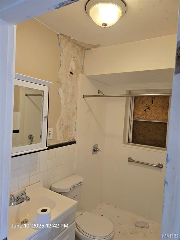 6203 Dardanella Ave, Normandy, MO 63121 - bathroom with tile walls, vanity, and a shower
