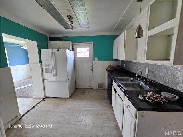 6203 Dardanella Ave, Normandy, MO 63121 - kitchen with white refrigerator with ice dispenser, dark countertops, a wainscoted wall, white cabinetry, and dishwasher