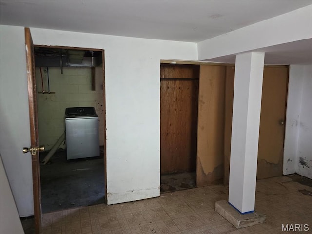 6203 Dardanella Ave, Normandy, MO 63121 - unfurnished bedroom featuring washer / clothes dryer, tile patterned floors, and multiple closets