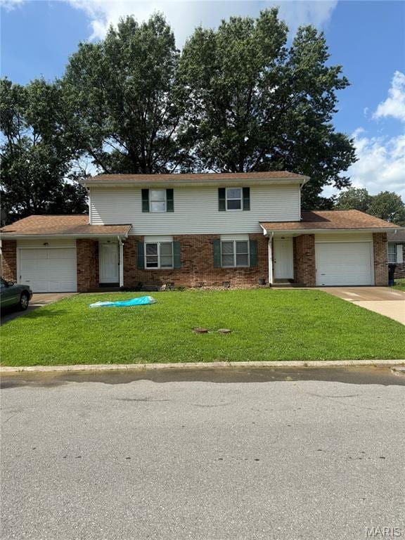 2821 Luce St, Cape Girardeau, MO 63701 - view of front of house featuring a garage, driveway, a front yard, and brick siding