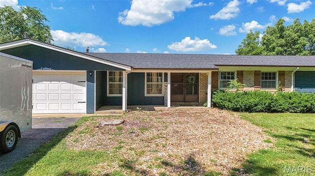 12575 State Route F, Rolla, MO 65401 - single story home with an attached garage, brick siding, asphalt driveway, a front lawn, and roof with shingles
