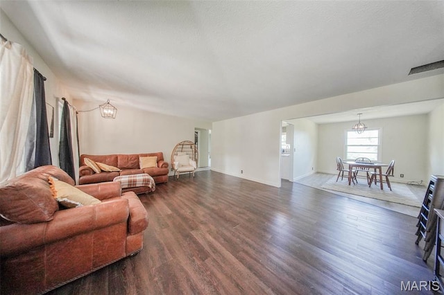 12575 State Route F, Rolla, MO 65401 - living room with dark wood finished floors and a chandelier