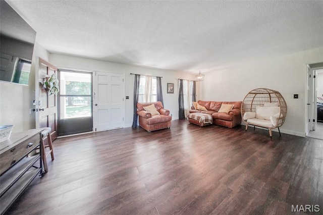 12575 State Route F, Rolla, MO 65401 - living room with dark wood-type flooring and a textured ceiling
