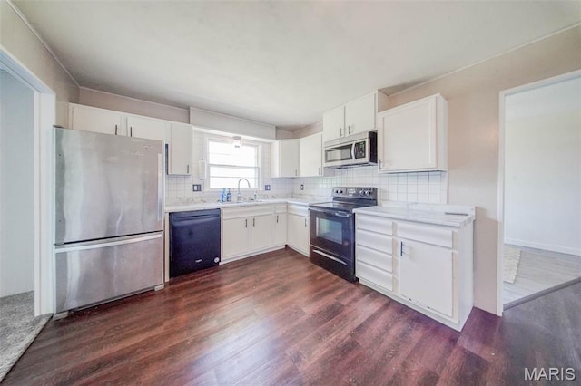 12575 State Route F, Rolla, MO 65401 - kitchen featuring black appliances, dark wood-style flooring, light countertops, tasteful backsplash, and white cabinetry