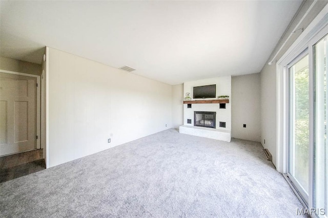 12575 State Route F, Rolla, MO 65401 - unfurnished living room with carpet and a brick fireplace
