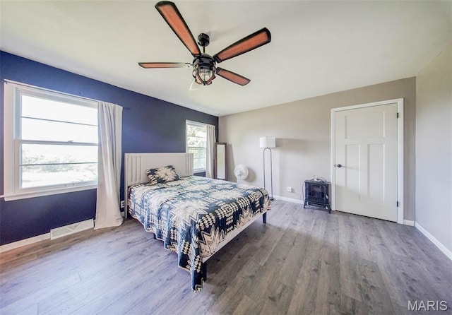 12575 State Route F, Rolla, MO 65401 - bedroom featuring wood finished floors and ceiling fan