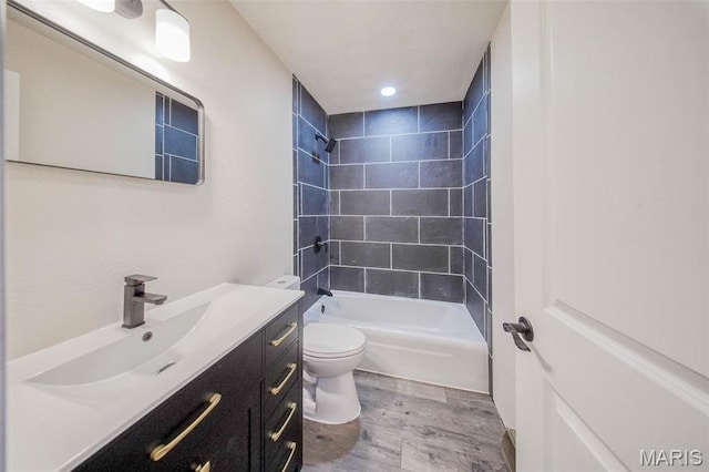12575 State Route F, Rolla, MO 65401 - bathroom with wood finished floors, vanity, bathtub / shower combination, and recessed lighting