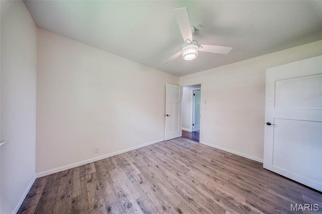 12575 State Route F, Rolla, MO 65401 - unfurnished bedroom with wood finished floors and ceiling fan