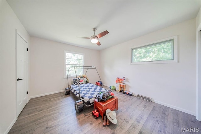 12575 State Route F, Rolla, MO 65401 - bedroom featuring wood finished floors and a ceiling fan