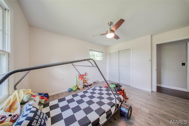 12575 State Route F, Rolla, MO 65401 - bedroom featuring wood finished floors, a closet, and a ceiling fan