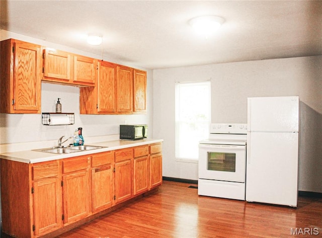 908 Birch St, Leadwood, MO 63653 - kitchen featuring white appliances, light countertops, and light wood-type flooring