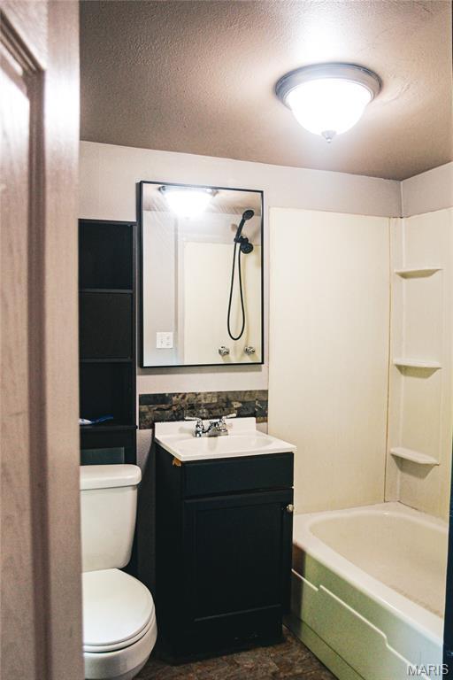 908 Birch St, Leadwood, MO 63653 - bathroom with vanity, a textured ceiling, and washtub / shower combination