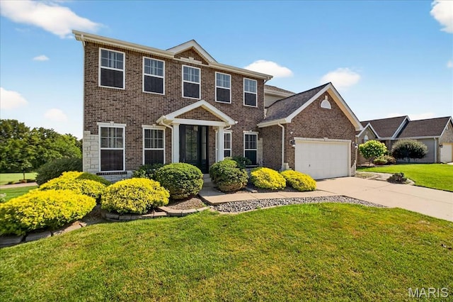612 Thornridge Dr, Ofallon, MO 63368 - view of front of home with a garage, brick siding, a front yard, and concrete driveway