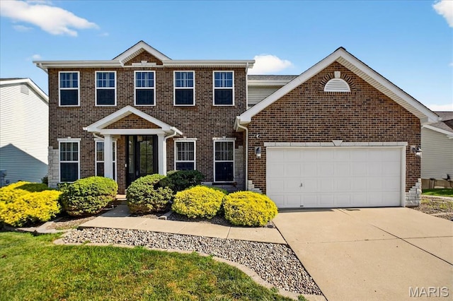 612 Thornridge Dr, Ofallon, MO 63368 - view of front of house featuring driveway, a garage, and brick siding