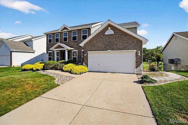 612 Thornridge Dr, Ofallon, MO 63368 - traditional home featuring brick siding, a front yard, a garage, and driveway