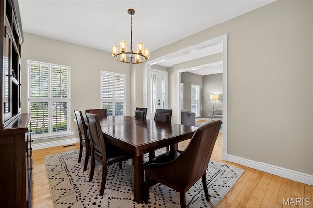 612 Thornridge Dr, Ofallon, MO 63368 - dining space featuring a chandelier and light wood-type flooring