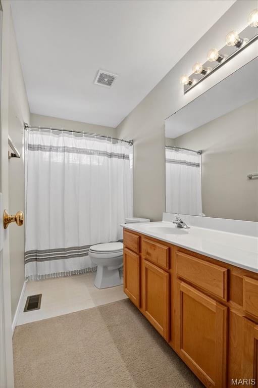 612 Thornridge Dr, Ofallon, MO 63368 - bathroom with vanity and a shower with shower curtain