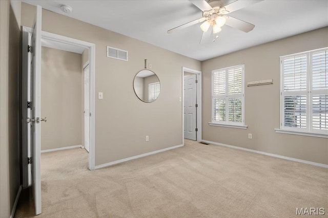 612 Thornridge Dr, Ofallon, MO 63368 - unfurnished bedroom with light colored carpet and a ceiling fan
