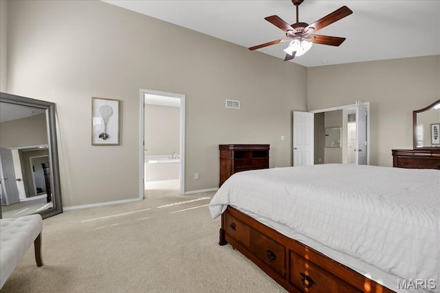 612 Thornridge Dr, Ofallon, MO 63368 - bedroom with light colored carpet, connected bathroom, high vaulted ceiling, and a ceiling fan
