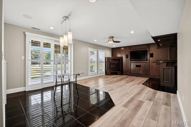 612 Thornridge Dr, Ofallon, MO 63368 - unfurnished living room featuring a ceiling fan, recessed lighting, and wood finished floors