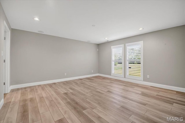 612 Thornridge Dr, Ofallon, MO 63368 - empty room with light wood-style floors and recessed lighting