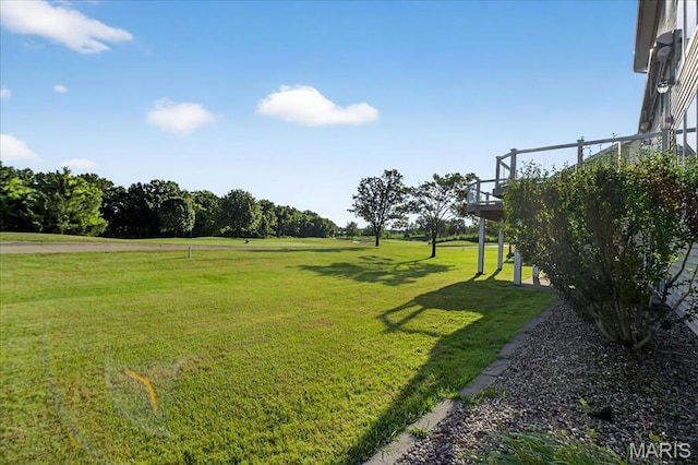 612 Thornridge Dr, Ofallon, MO 63368 - view of green lawn with a wooden deck