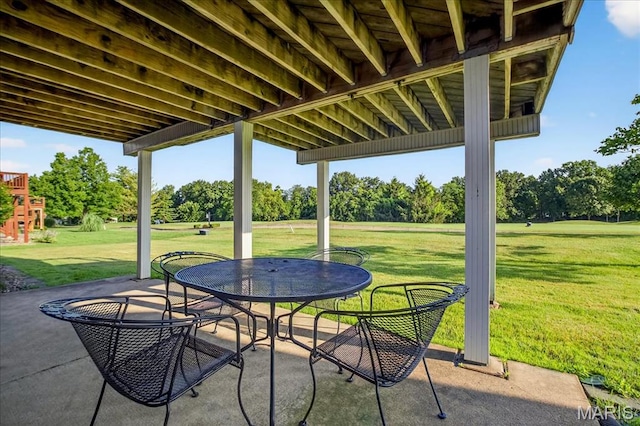 612 Thornridge Dr, Ofallon, MO 63368 - view of patio / terrace with view of wooded area and outdoor dining space
