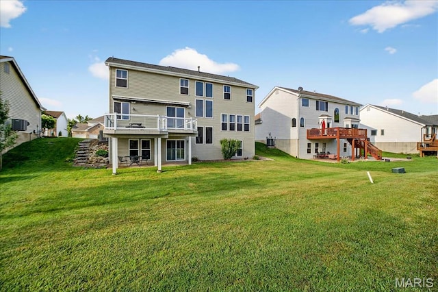 612 Thornridge Dr, Ofallon, MO 63368 - back of property featuring a wooden deck, a residential view, and a yard
