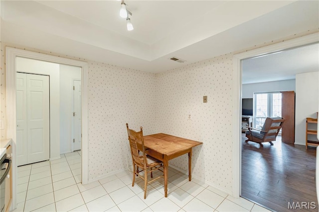917 Claytonbrook Dr Unit 3, Ballwin, MO 63011 - dining room featuring light tile patterned flooring and wallpapered walls
