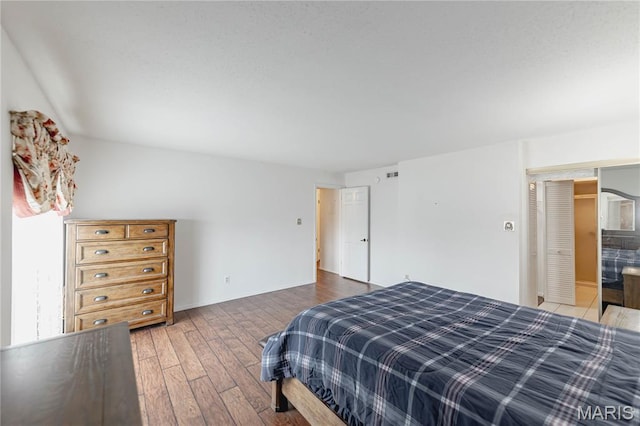 917 Claytonbrook Dr Unit 3, Ballwin, MO 63011 - bedroom with hardwood / wood-style floors and baseboards