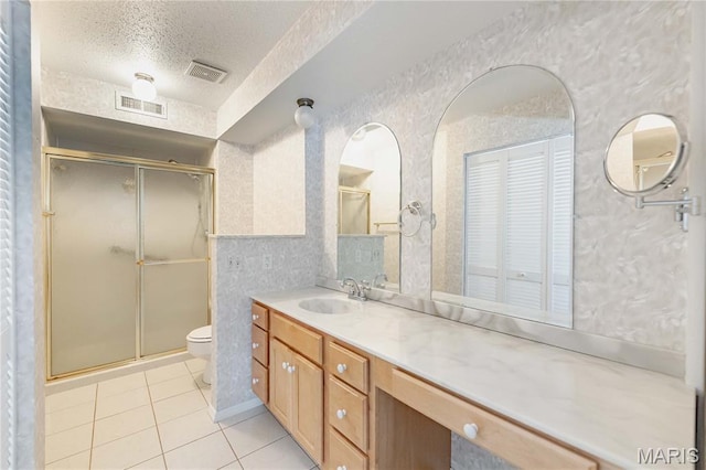 917 Claytonbrook Dr Unit 3, Ballwin, MO 63011 - bathroom featuring tile patterned flooring, a stall shower, vanity, and a textured ceiling