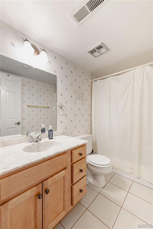917 Claytonbrook Dr Unit 3, Ballwin, MO 63011 - full bath featuring vanity, wallpapered walls, tile patterned floors, and a shower with shower curtain
