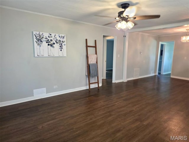1309 E E Oak St, Dexter, MO 63841 - spare room with ceiling fan, a chandelier, dark wood finished floors, and crown molding