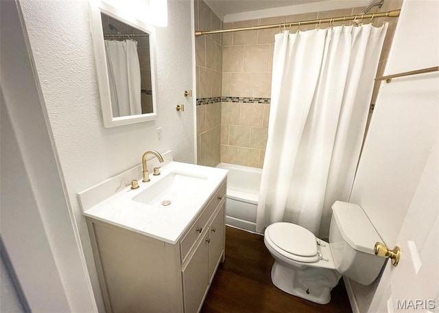 1309 E E Oak St, Dexter, MO 63841 - bathroom with vanity, wood finished floors, a textured wall, and shower / bath combo