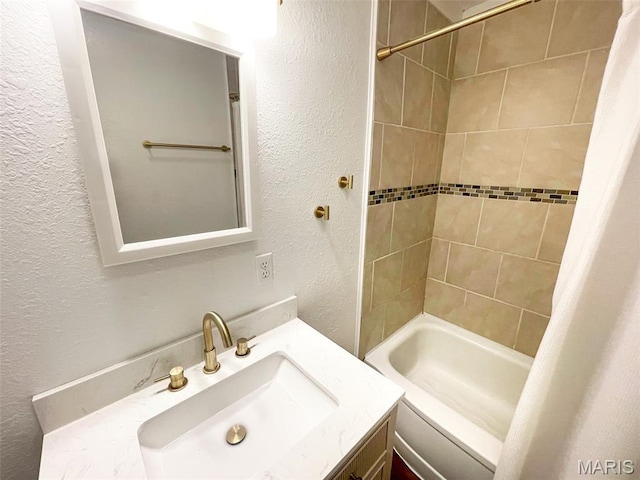 1309 E E Oak St, Dexter, MO 63841 - full bathroom with a textured wall, vanity, and shower / bath combo