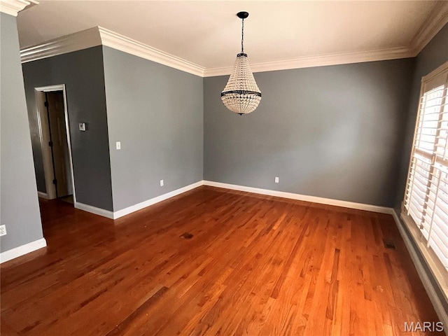 114 Cloverleaf Meadows Ct, Ofallon, MO 63366 - spare room featuring a chandelier, wood finished floors, and crown molding