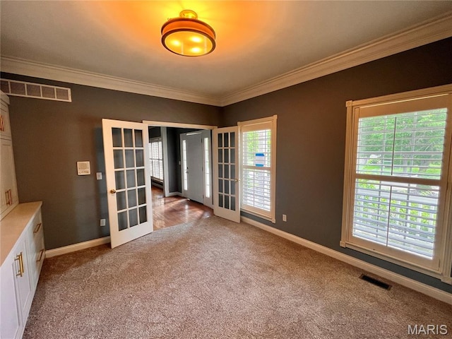 114 Cloverleaf Meadows Ct, Ofallon, MO 63366 - carpeted spare room featuring french doors and crown molding